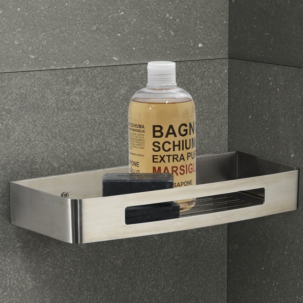 product lifestyle image of origins living nerva brushed stainless steel shower basket close up on grey marble wall